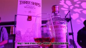 Three Ships Pinotage Cask Finish Whisky bathed in pink light